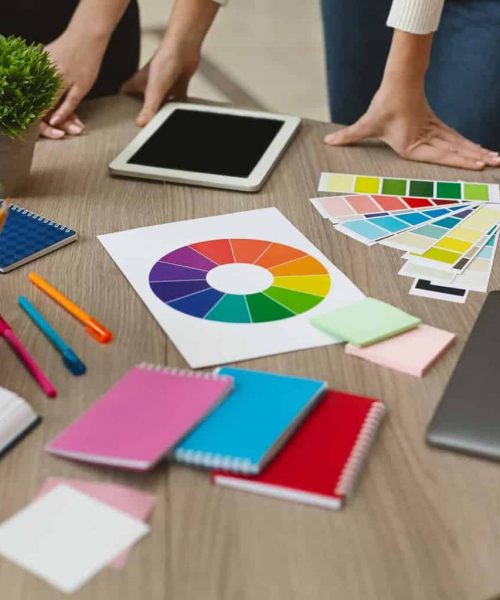 Group of graphic designers checking on color swatch samples